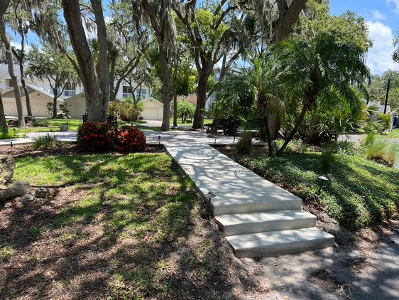 Concrete sidewalk with integrated stairs